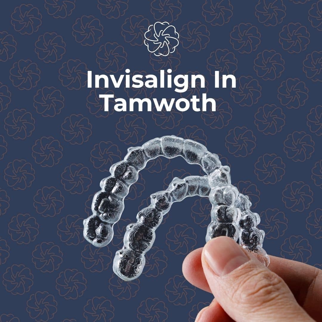 Hand holding clear Invisalign aligners in Tamworth