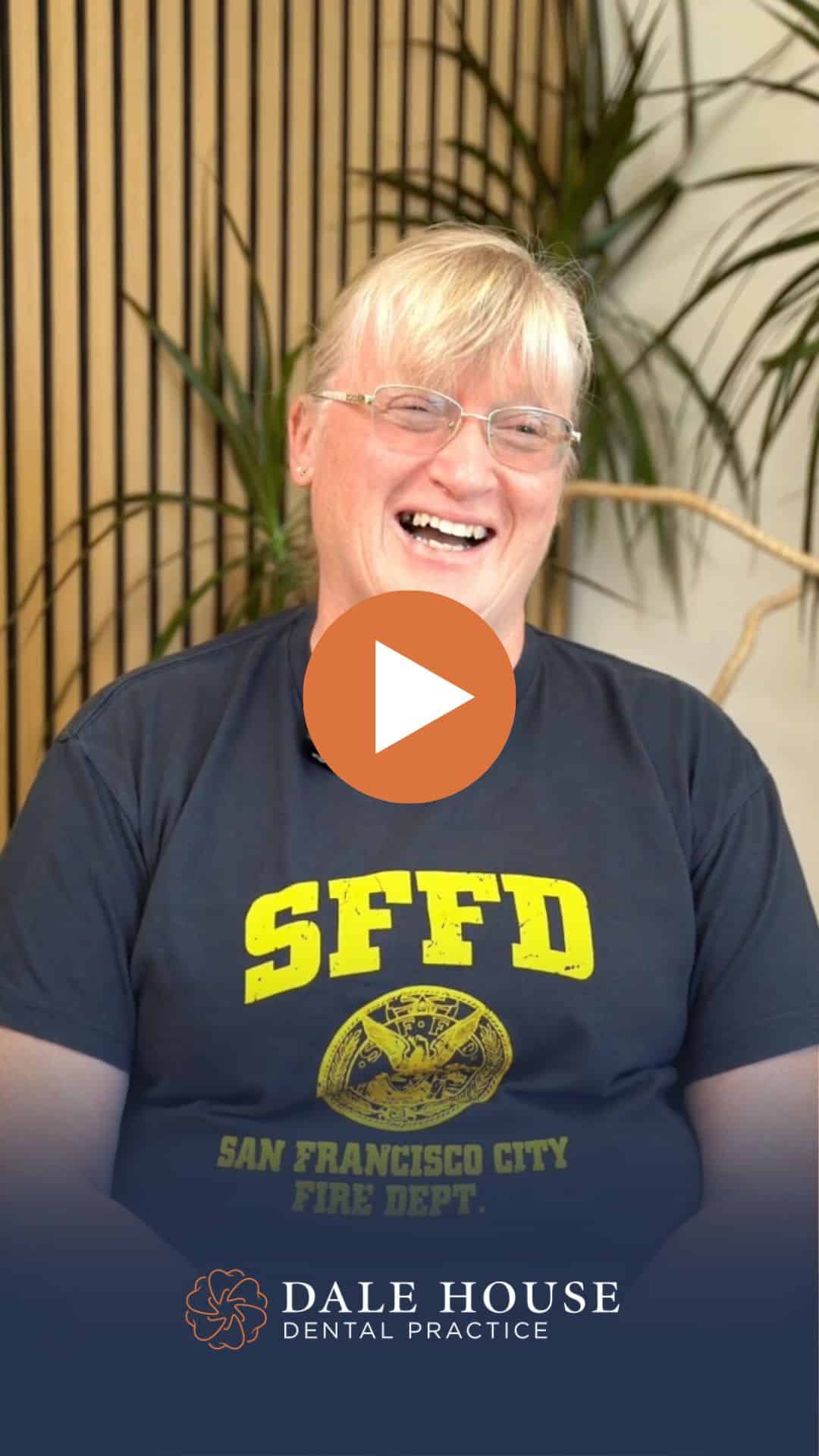 Smiling woman in SFFD shirt at Dale House Dental Practice