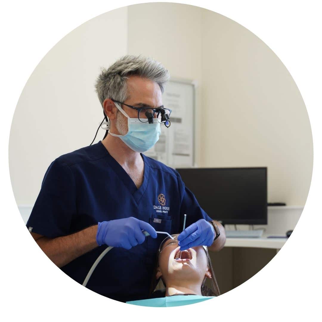 Dentist performing dental examination on a patient