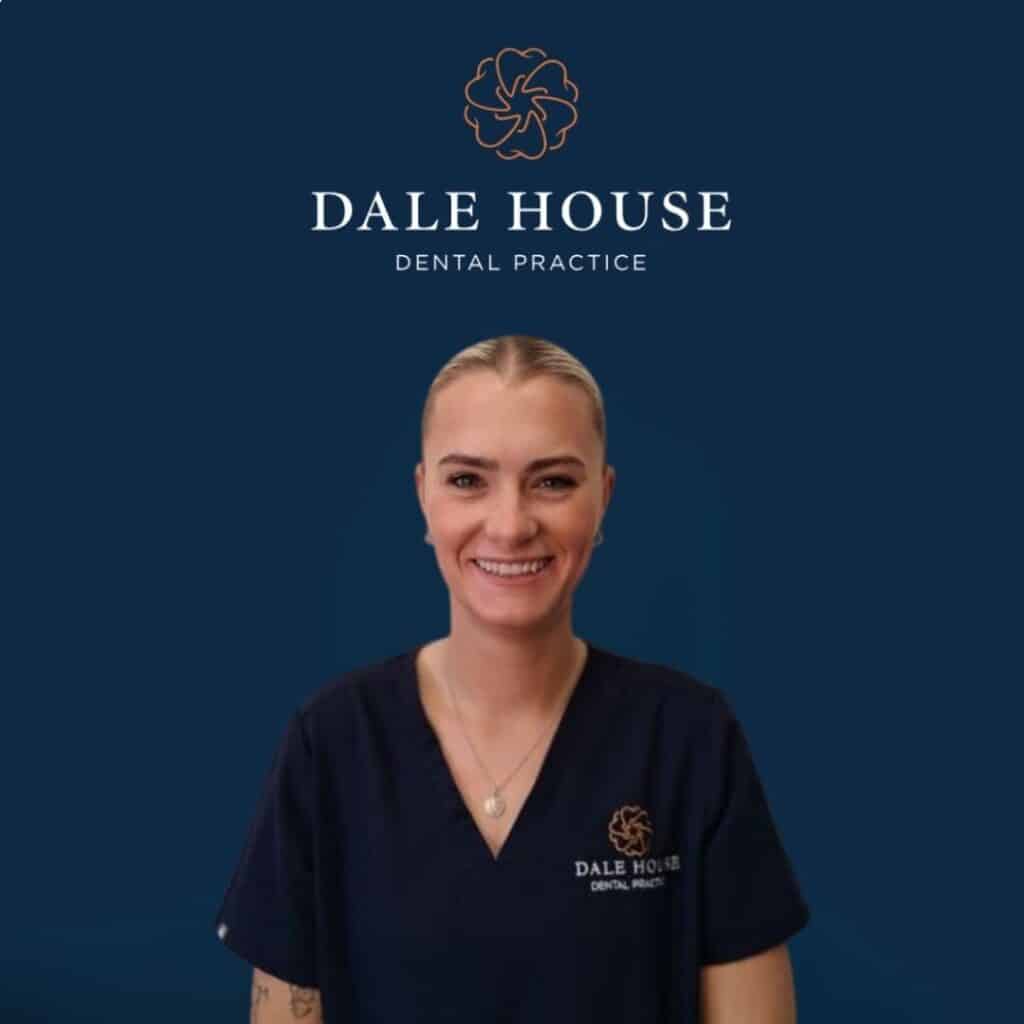 Smiling dental professional in Dale House Dental Practice scrubs