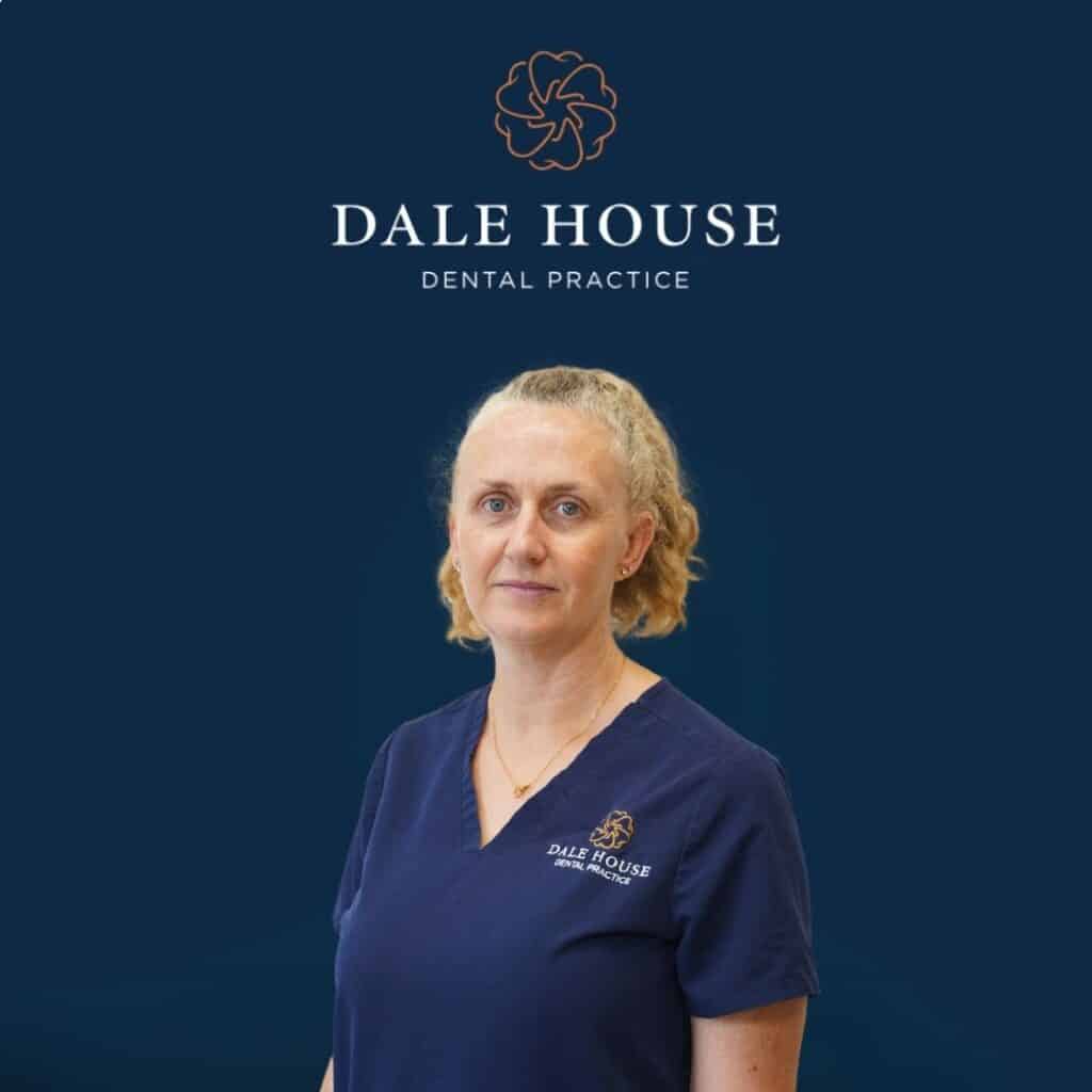 Dale House Dental Practice staff member in navy scrubs