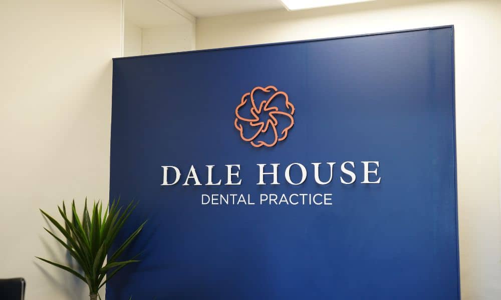 Dale House Dental Practice reception sign with floral logo