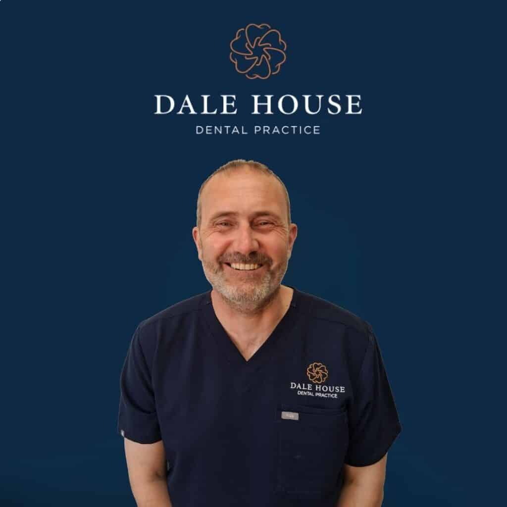 Smiling male dentist in Dale House Dental Practice scrubs
